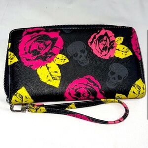 Betsey Johnson zip around wallet with skulls and pink roses.